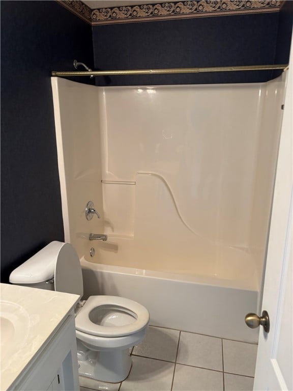 5095 Saxon St, Springdale, AR 72764 - bathroom featuring tile patterned floors, toilet, vanity, and shower / washtub combination