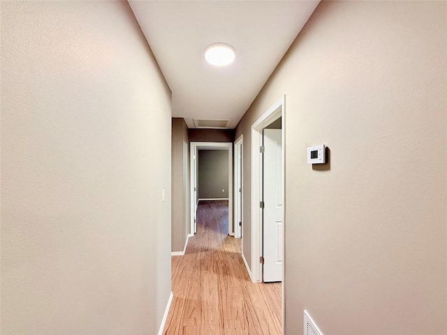10098 Bayview Rd, Dardanelle, AR 72834 - corridor with baseboards and light wood finished floors