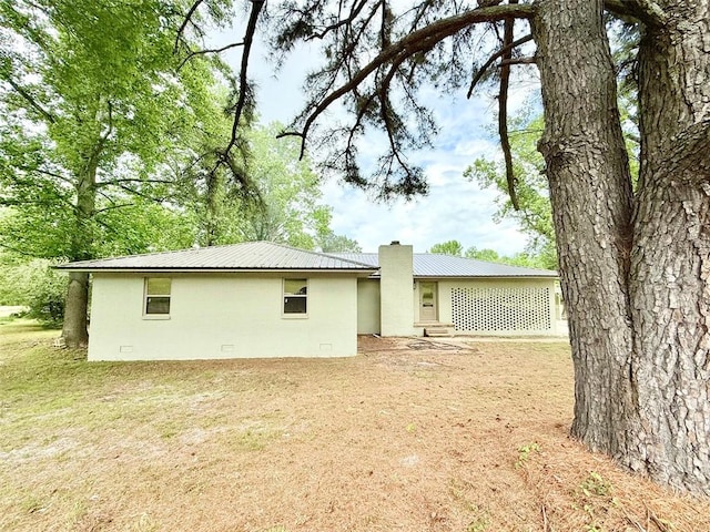 10098 Bayview Rd, Dardanelle, AR 72834 - back of property featuring a chimney and metal roof