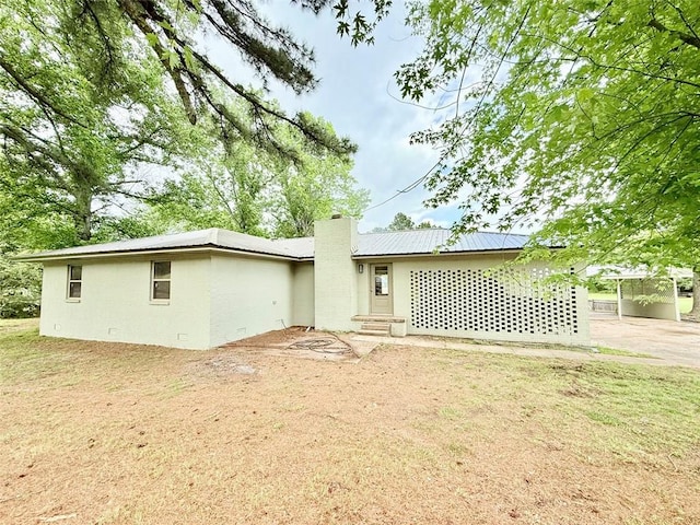 10098 Bayview Rd, Dardanelle, AR 72834 - back of house with a chimney and entry steps