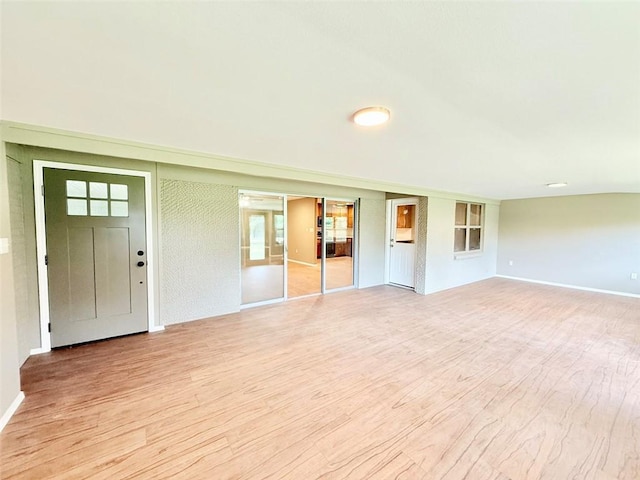 10098 Bayview Rd, Dardanelle, AR 72834 - unfurnished living room featuring light wood-style flooring and baseboards