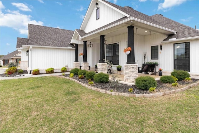 1904 Tull Dr, Pea Ridge, AR 72751 - modern farmhouse featuring roof with shingles, covered porch, and a front lawn