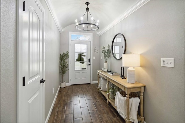 1904 Tull Dr, Pea Ridge, AR 72751 - doorway to outside with a chandelier, baseboards, crown molding, dark wood-style floors, and vaulted ceiling