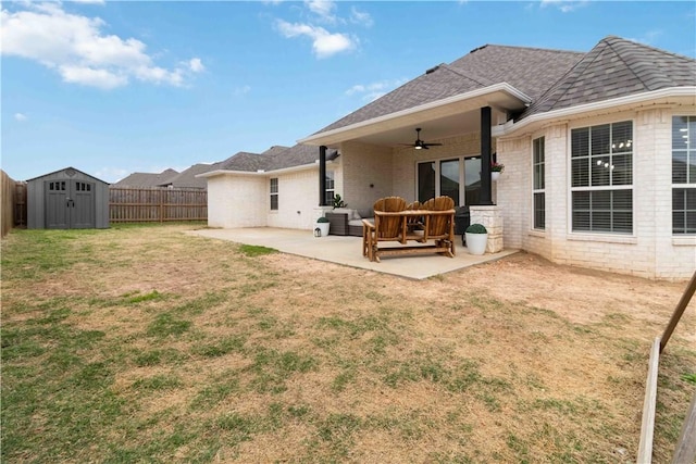 1904 Tull Dr, Pea Ridge, AR 72751 - back of property with a ceiling fan, a patio, outdoor lounge area, a storage shed, and brick siding