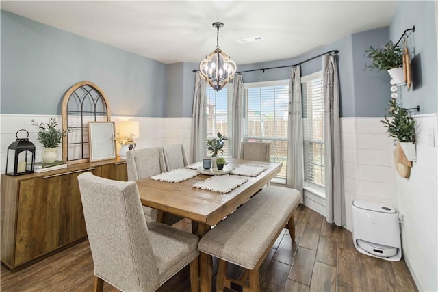 1904 Tull Dr, Pea Ridge, AR 72751 - dining area with a chandelier, dark wood-style flooring, and a wainscoted wall