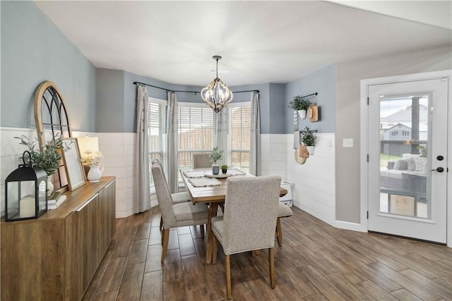 1904 Tull Dr, Pea Ridge, AR 72751 - dining room with a chandelier, dark wood-style floors, a wainscoted wall, and tile walls