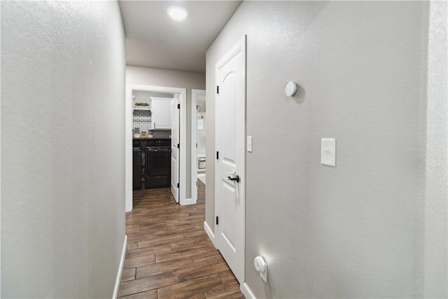 1904 Tull Dr, Pea Ridge, AR 72751 - corridor featuring dark wood-style floors and baseboards