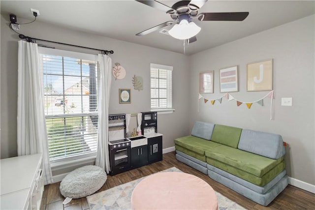 1904 Tull Dr, Pea Ridge, AR 72751 - living room featuring ceiling fan, baseboards, and wood finished floors