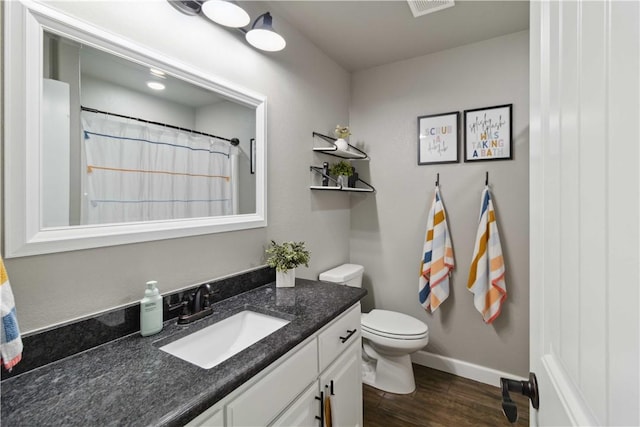 1904 Tull Dr, Pea Ridge, AR 72751 - bathroom with wood finished floors, vanity, toilet, and baseboards