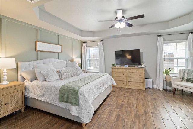 1904 Tull Dr, Pea Ridge, AR 72751 - bedroom featuring a tray ceiling, wood finished floors, and ceiling fan