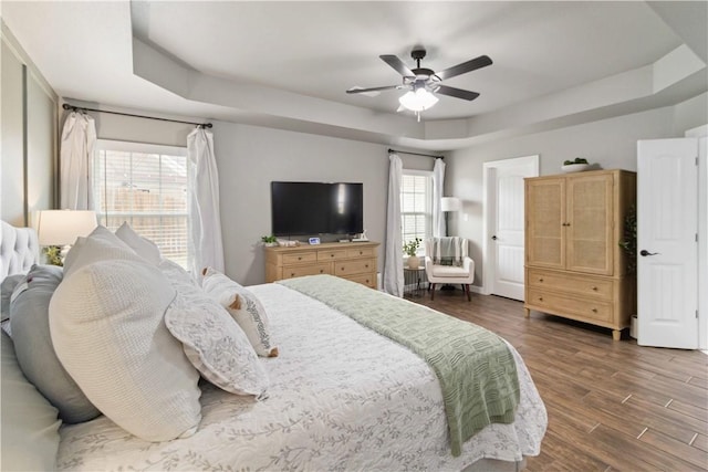 1904 Tull Dr, Pea Ridge, AR 72751 - bedroom with a tray ceiling, dark wood finished floors, and ceiling fan