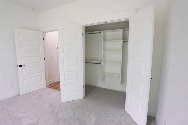 3 Berkshire Dr, Bella Vista, AR 72714 - unfurnished bedroom featuring carpet floors, a closet, and baseboards