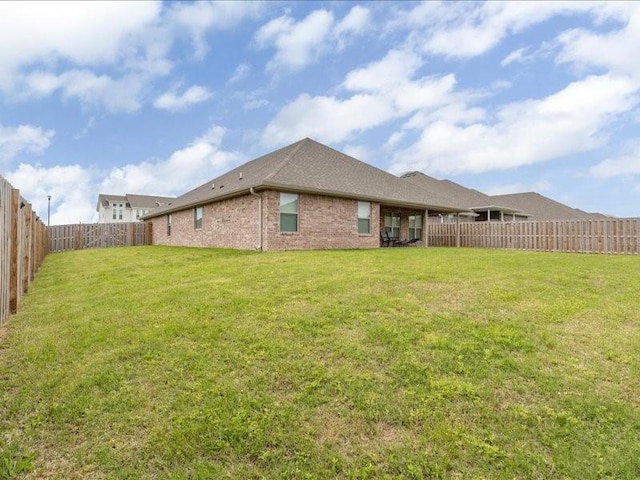 back of house featuring brick siding