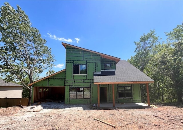 49 Clevelys Ln, Bella Vista, AR 72715 - rear view of house featuring a shingled roof
