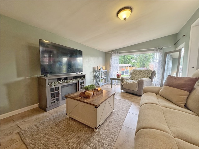 1008 E H St, Russellville, AR 72801 - living area with vaulted ceiling and a glass covered fireplace
