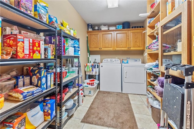 3277 Bellefonte Rd, Harrison, AR 72601 - washroom with washing machine and dryer, cabinet space, and light tile patterned flooring
