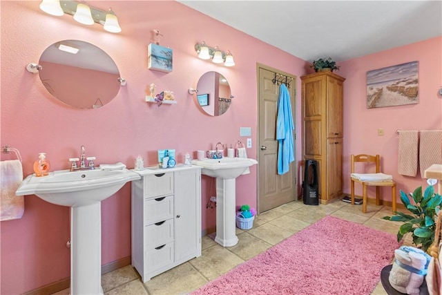 3277 Bellefonte Rd, Harrison, AR 72601 - bathroom with two sinks, tile patterned flooring, and baseboards