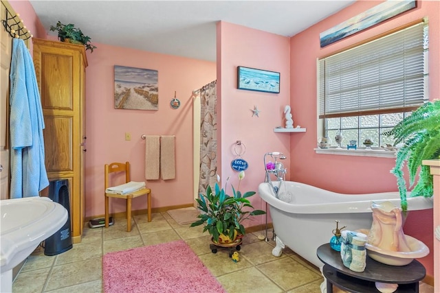 3277 Bellefonte Rd, Harrison, AR 72601 - bathroom featuring a freestanding tub, baseboards, and curtained shower