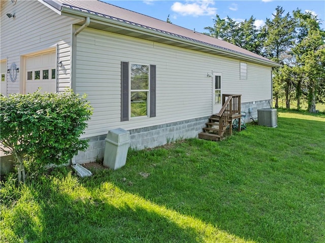 3277 Bellefonte Rd, Harrison, AR 72601 - view of side of home with cooling unit, a lawn, metal roof, and a garage