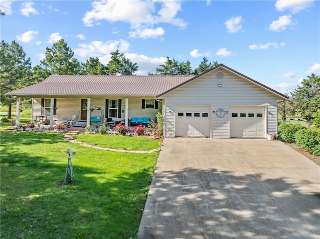 3277 Bellefonte Rd, Harrison, AR 72601 - view of front of home with covered porch, an attached garage, concrete driveway, metal roof, and a front yard