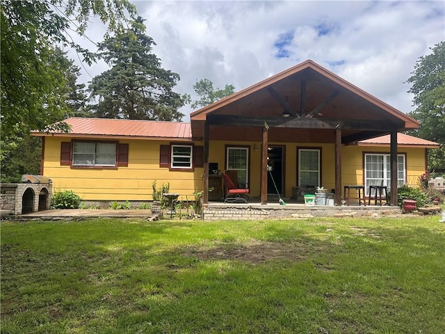 11836 Fresno Rd, West Fork, AR 72774 - rear view of house with a yard and metal roof