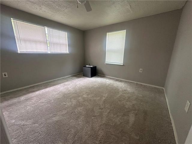 11836 Fresno Rd, West Fork, AR 72774 - empty room featuring carpet floors, ceiling fan, a textured ceiling, and baseboards
