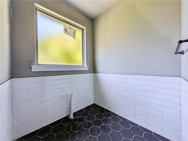 10 Olmsted Cir, Bella Vista, AR 72715 - bathroom featuring tile walls, wainscoting, and tile patterned floors