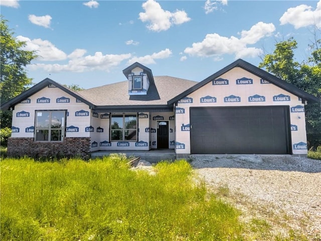 10 Olmsted Cir, Bella Vista, AR 72715 - property under construction with a garage, driveway, roof with shingles, and brick siding