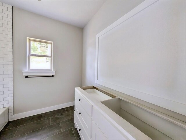 10 Olmsted Cir, Bella Vista, AR 72715 - bathroom with baseboards, a bath, tile patterned floors, and a shower