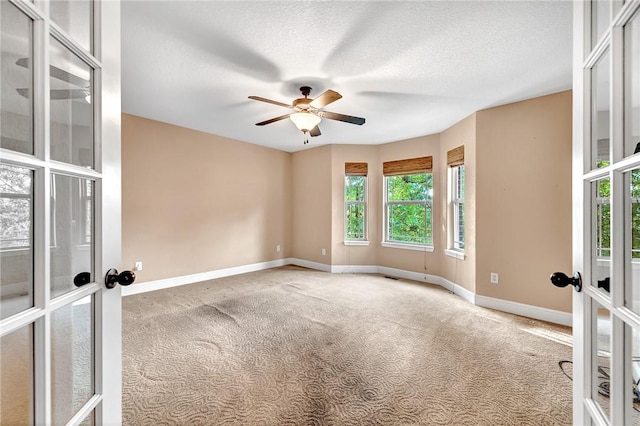 21 Sidlaw Hills Dr, Bella Vista, AR 72715 - unfurnished room with french doors, carpet, healthy amount of natural light, and a textured ceiling