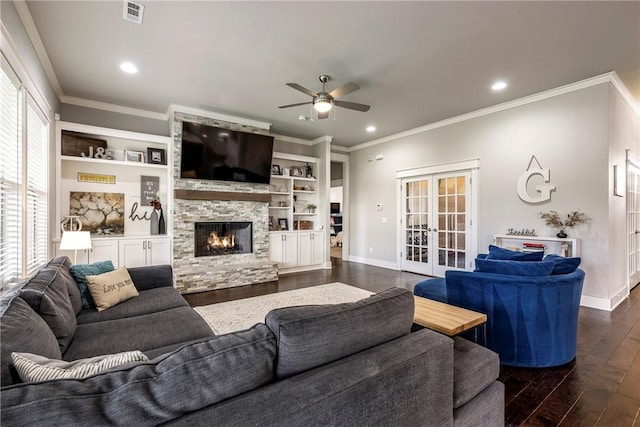 living room with ceiling fan, dark wood-style flooring, ornamental molding, a fireplace, and baseboards