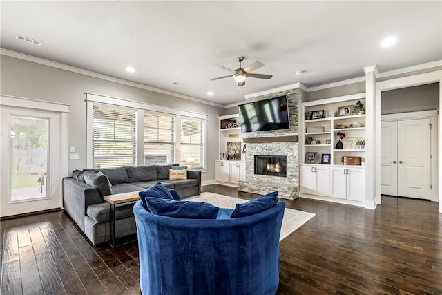 living area featuring a ceiling fan, plenty of natural light, dark wood-style floors, crown molding, and recessed lighting