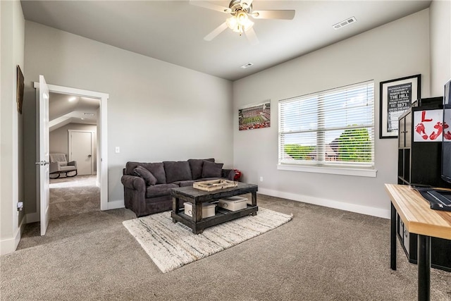 carpeted living room featuring a ceiling fan and baseboards