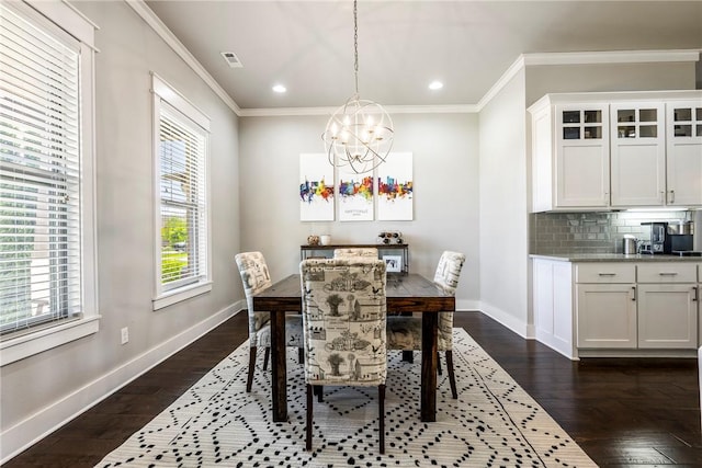 dining area featuring a chandelier, crown molding, dark wood-style floors, baseboards, and recessed lighting