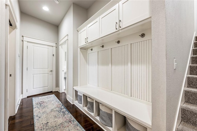 mudroom with dark wood-type flooring, baseboards, and recessed lighting