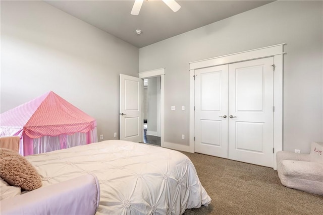 bedroom featuring carpet floors, a closet, ceiling fan, and baseboards