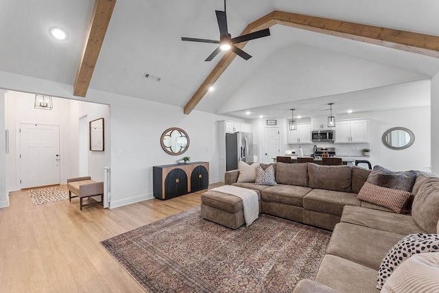 living room featuring high vaulted ceiling, ceiling fan, recessed lighting, beamed ceiling, and light wood-type flooring
