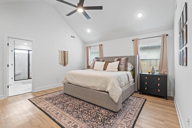 bedroom with high vaulted ceiling, light wood-style floors, multiple windows, baseboards, and recessed lighting