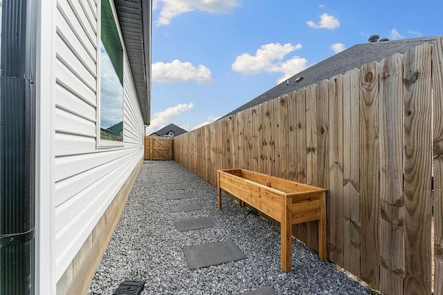 view of side of home with fence