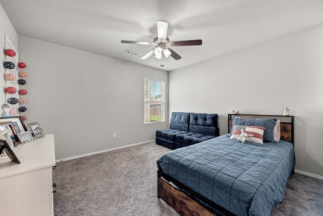 carpeted bedroom featuring baseboards and ceiling fan