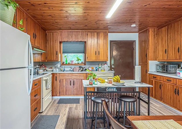 239 Mc 7043, Flippin, AR 72634 - kitchen with white appliances, light wood finished floors, light countertops, wooden ceiling, and brown cabinets
