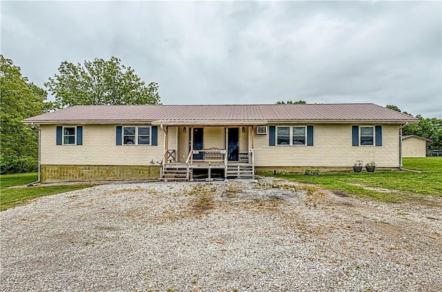 239 Mc 7043, Flippin, AR 72634 - view of front facade with covered porch and metal roof