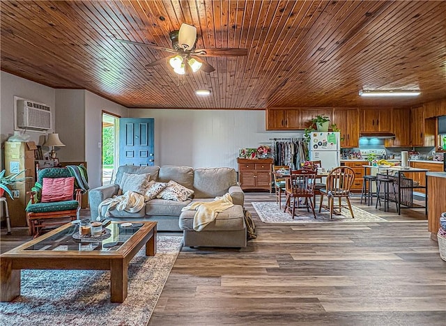 239 Mc 7043, Flippin, AR 72634 - living area with a wall mounted air conditioner, ceiling fan, wood finished floors, and wood ceiling