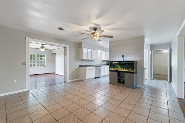 1207 SE E St, Bentonville, AR 72712 - kitchen with dishwasher, light tile patterned floors, a ceiling fan, open shelves, and white cabinets