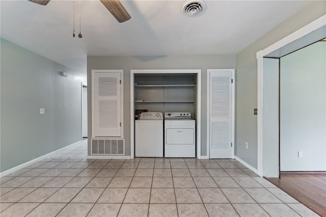 1207 SE E St, Bentonville, AR 72712 - laundry room featuring separate washer and dryer, a ceiling fan, light tile patterned floors, and baseboards