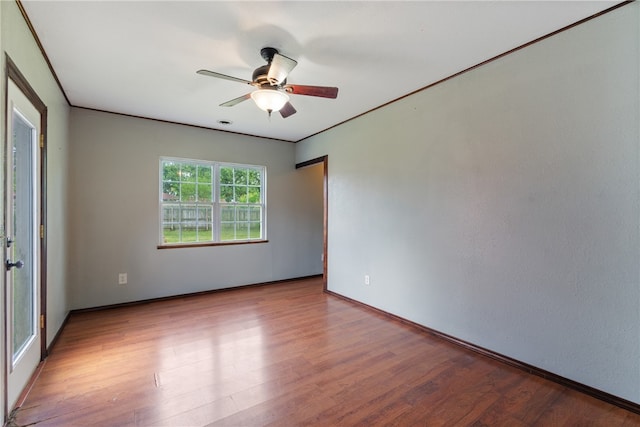 1207 SE E St, Bentonville, AR 72712 - spare room with wood finished floors, ceiling fan, and baseboards