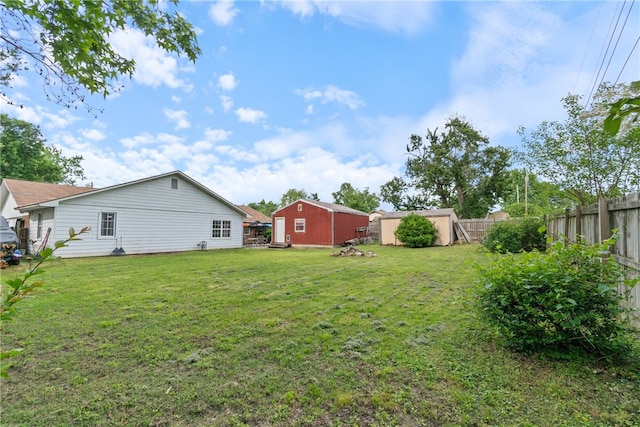 1207 SE E St, Bentonville, AR 72712 - view of yard featuring an outbuilding