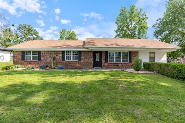 1207 SE E St, Bentonville, AR 72712 - single story home featuring a front yard, brick siding, and central AC unit