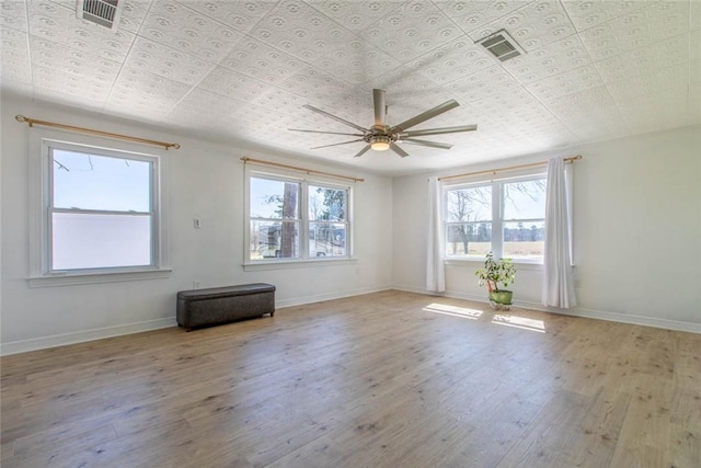 2193 Nevada 18 Rd, Prescott, AR 71857 - spare room with ceiling fan, wood finished floors, baseboards, and an ornate ceiling