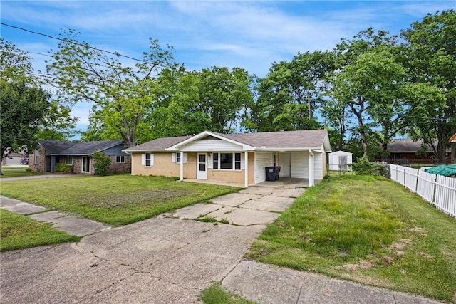 806 W 3rd St, Russellville, AR 72801 - ranch-style house featuring a carport, concrete driveway, and brick siding